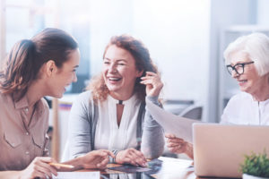 Three generations of women working in the office.